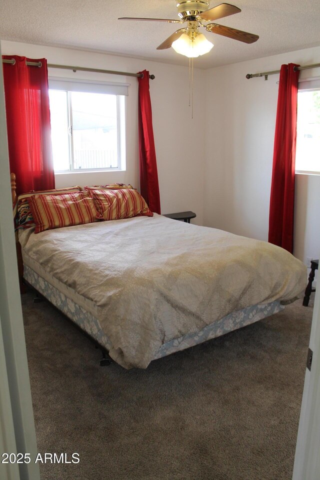 235 N 61st Pl, Mesa, AZ 85205 - carpeted bedroom featuring a ceiling fan and a textured ceiling