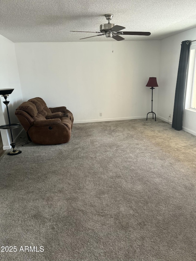 235 N 61st Pl, Mesa, AZ 85205 - unfurnished room with a textured ceiling, carpet floors, ceiling fan, and baseboards