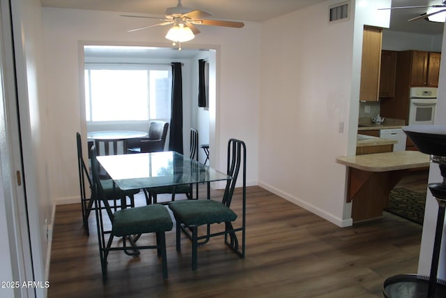 235 N 61st Pl, Mesa, AZ 85205 - dining area with a ceiling fan, dark wood-type flooring, and baseboards