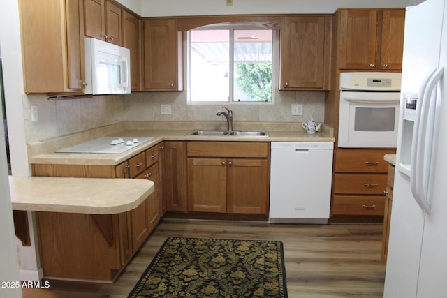 235 N 61st Pl, Mesa, AZ 85205 - kitchen featuring white appliances, a sink, wood finished floors, and light countertops