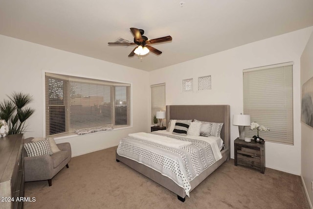 carpeted bedroom featuring ceiling fan