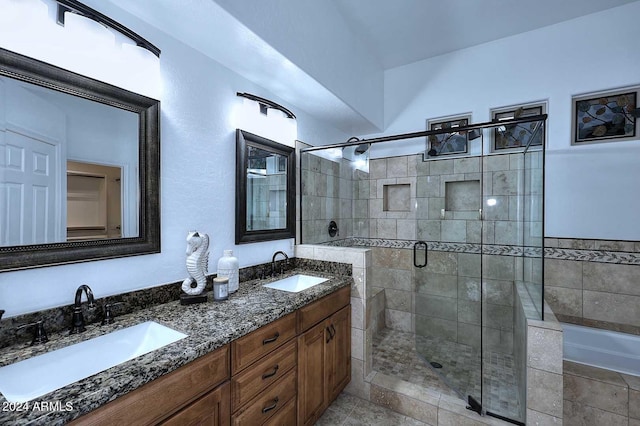 bathroom with separate shower and tub and vanity