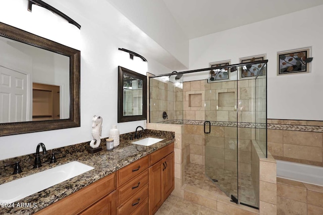 bathroom featuring vanity and plus walk in shower