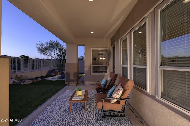 view of patio terrace at dusk