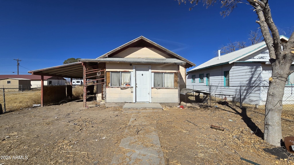 exterior space featuring a carport