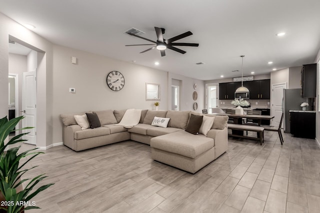 17437 W Via De Luna Dr, Surprise, AZ 85387 - living area featuring recessed lighting, a ceiling fan, light wood-type flooring, and visible vents