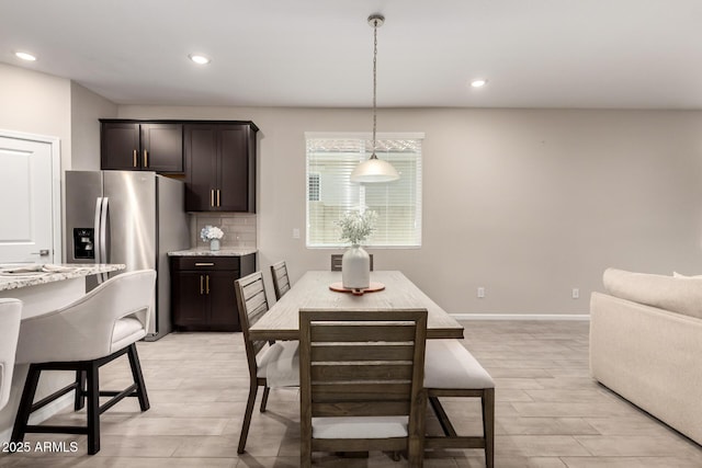 17437 W Via De Luna Dr, Surprise, AZ 85387 - dining space featuring baseboards, light wood finished floors, and recessed lighting