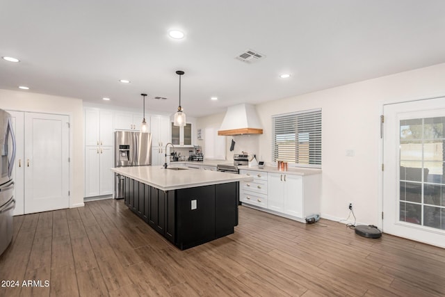 12043 N 46th Ave, Glendale, AZ 85304 - kitchen with premium range hood, appliances with stainless steel finishes, light countertops, white cabinets, and recessed lighting