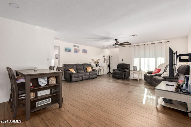 12043 N 46th Ave, Glendale, AZ 85304 - living room featuring wood finished floors and ceiling fan