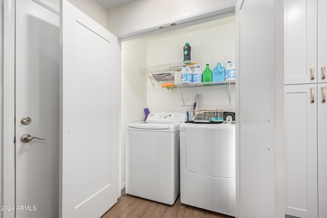 12043 N 46th Ave, Glendale, AZ 85304 - laundry room with light wood-type flooring and washing machine and clothes dryer