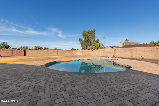 12043 N 46th Ave, Glendale, AZ 85304 - view of pool with a patio and a fenced backyard