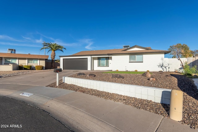 12043 N 46th Ave, Glendale, AZ 85304 - ranch-style home featuring driveway and an attached garage
