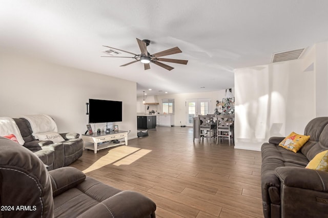 12043 N 46th Ave, Glendale, AZ 85304 - living room featuring a ceiling fan, wood finished floors, and baseboards