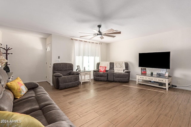 12043 N 46th Ave, Glendale, AZ 85304 - living area with wood finished floors, a ceiling fan, and baseboards