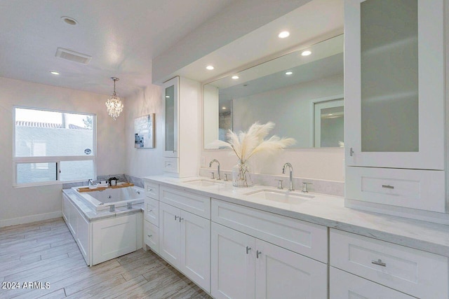 bathroom with vanity and a bathing tub