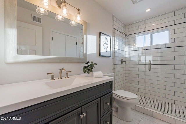 bathroom with vanity, toilet, and walk in shower