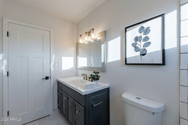 bathroom with toilet and vanity