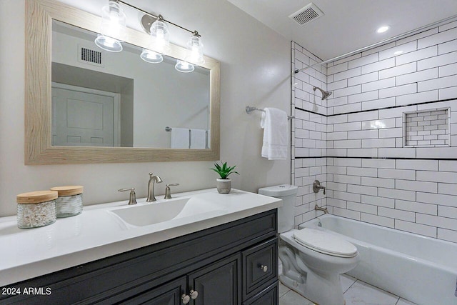 full bathroom with tiled shower / bath combo, vanity, and toilet