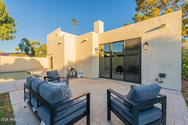 view of patio featuring a fenced in pool