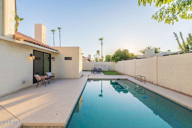 view of pool featuring a patio