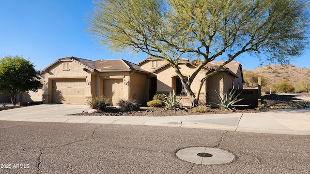 view of front of house with a garage and a mountain view