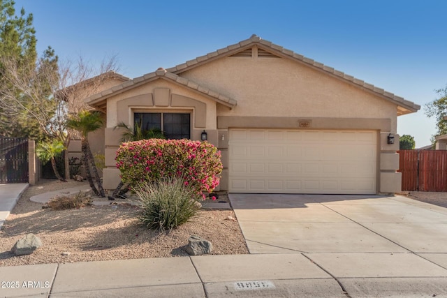 ranch-style home featuring a garage