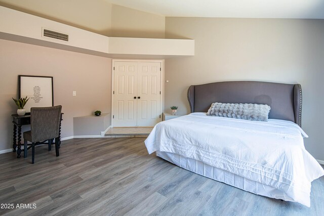 11025 N 10th St, Phoenix, AZ 85020 - bedroom with wood finished floors and vaulted ceiling