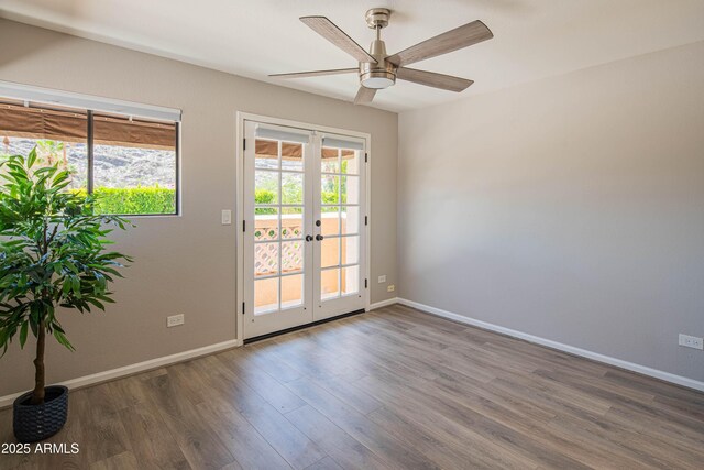 11025 N 10th St, Phoenix, AZ 85020 - spare room with wood finished floors, french doors, and a ceiling fan