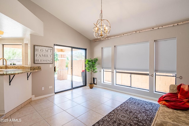 11025 N 10th St, Phoenix, AZ 85020 - doorway featuring a chandelier, light tile patterned floors, and high vaulted ceiling