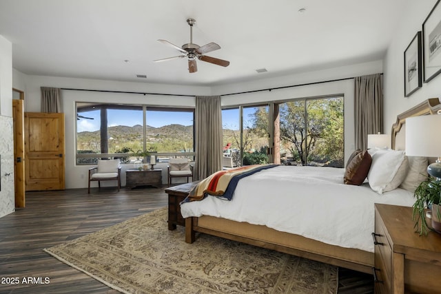 bedroom with visible vents and dark wood finished floors