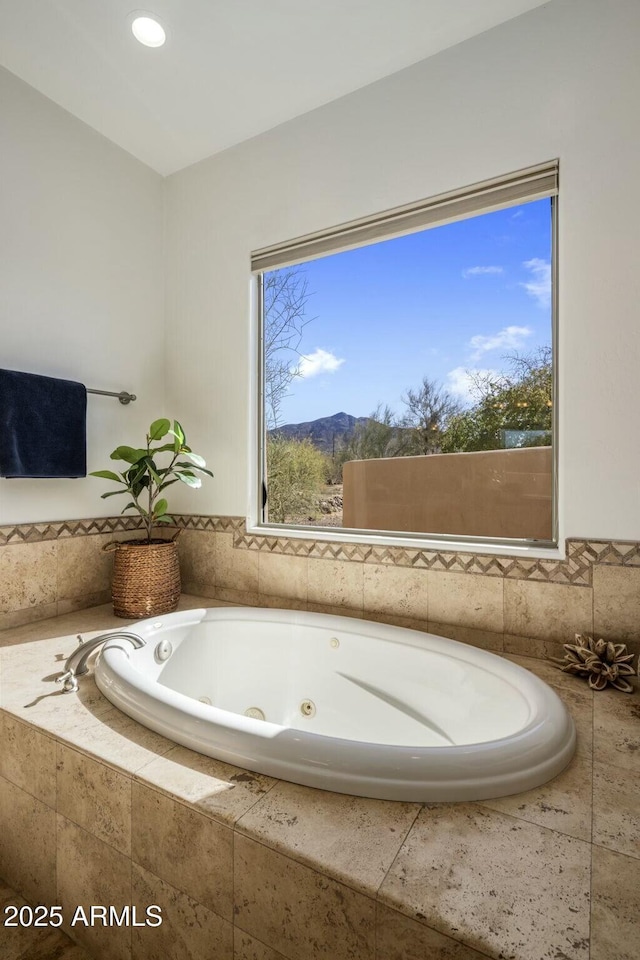 bathroom featuring a tub with jets