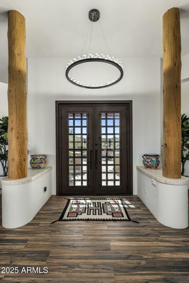 entrance foyer with wood finished floors and french doors