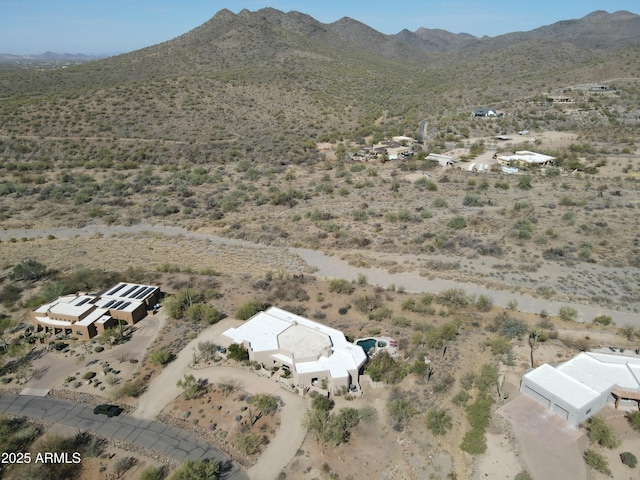 birds eye view of property featuring a desert view and a mountain view