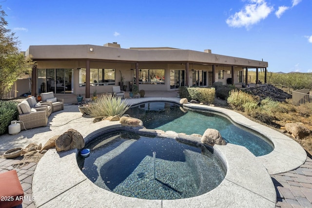 view of pool featuring a patio area and a pool with connected hot tub