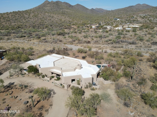 aerial view with a desert view and a mountain view