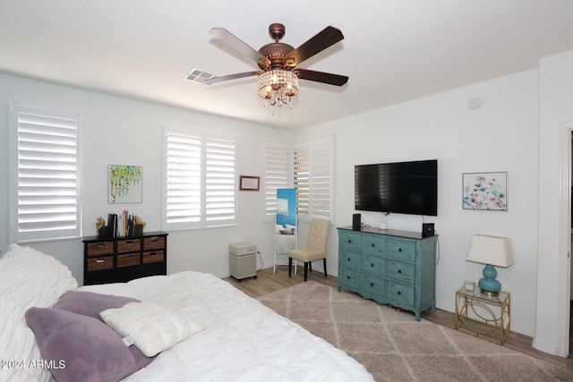 bedroom featuring ceiling fan and light wood-type flooring