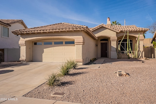 mediterranean / spanish-style house featuring a garage