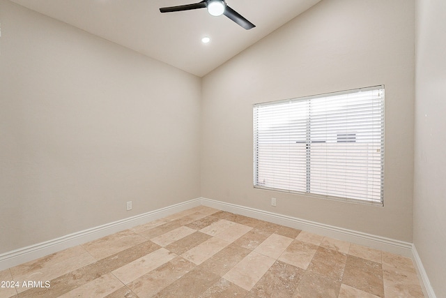 empty room featuring ceiling fan and high vaulted ceiling