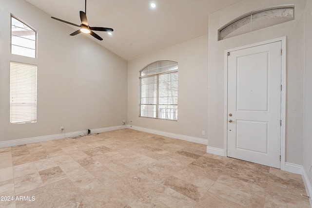 entrance foyer with ceiling fan, plenty of natural light, and high vaulted ceiling