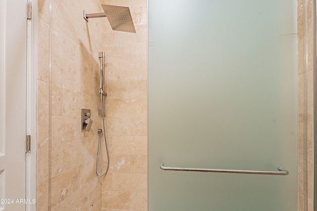 bathroom with a shower with shower door