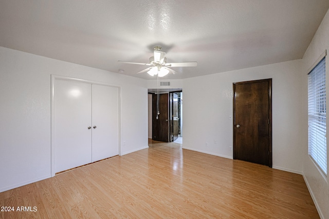 unfurnished bedroom featuring ceiling fan and light hardwood / wood-style floors