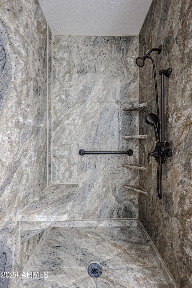 bathroom featuring a tile shower