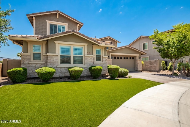 view of front of property featuring a garage and a front lawn