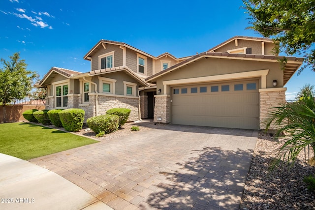 view of front of property featuring a garage and a front yard