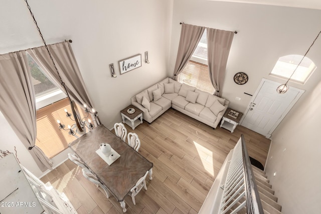 living room with stairs and wood finished floors