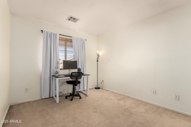 carpeted home office with baseboards and visible vents