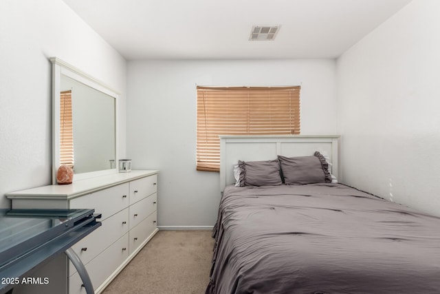 bedroom with light colored carpet and visible vents