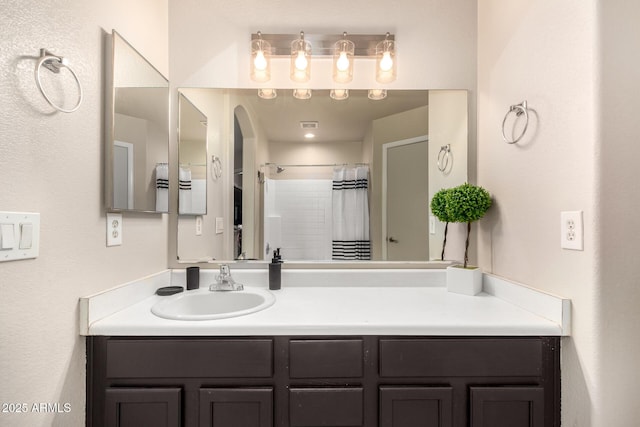 bathroom featuring vanity and a shower with curtain