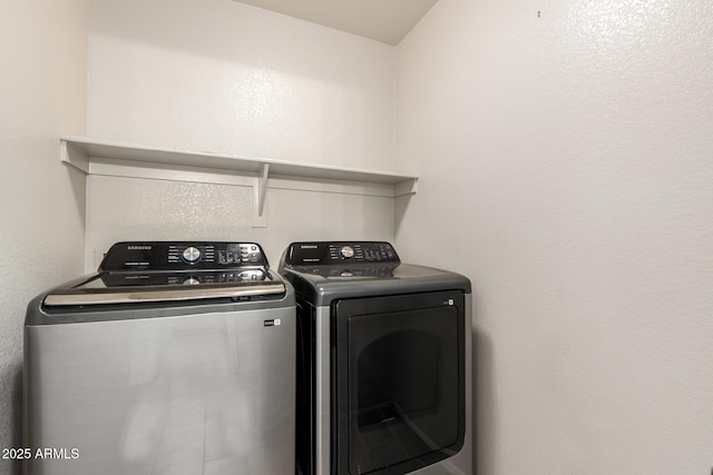 laundry room featuring laundry area and separate washer and dryer