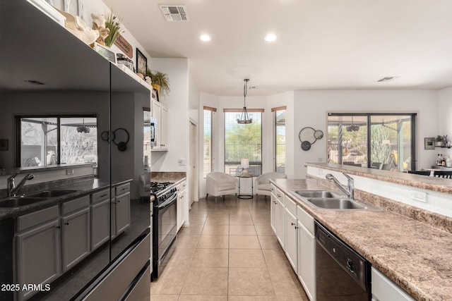 9260 E Greenway St, Mesa, AZ 85207 - kitchen with visible vents, black appliances, a sink, and white cabinetry